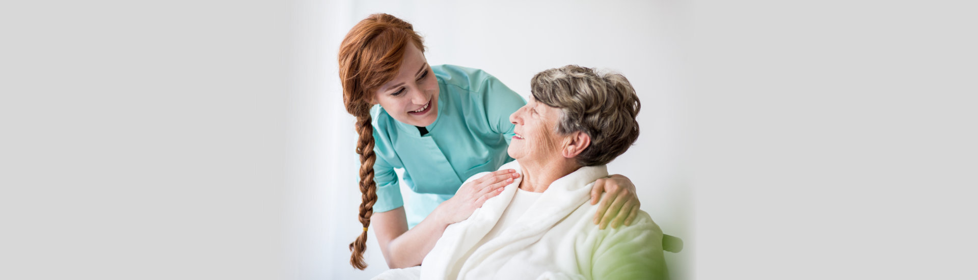 caregiver talking to her patient