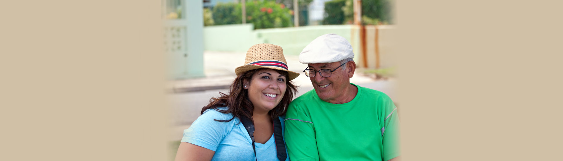 caregiver and elderly man smiling