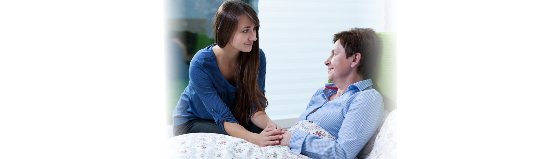 caregiver and her patient looking at each other