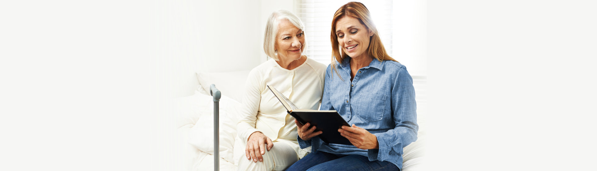 caregiver and patient looking at the album