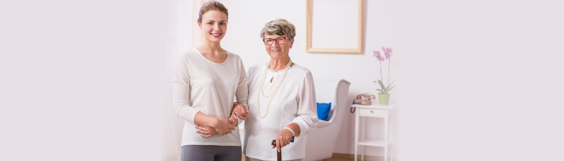 caregiver assisting her elderly patient